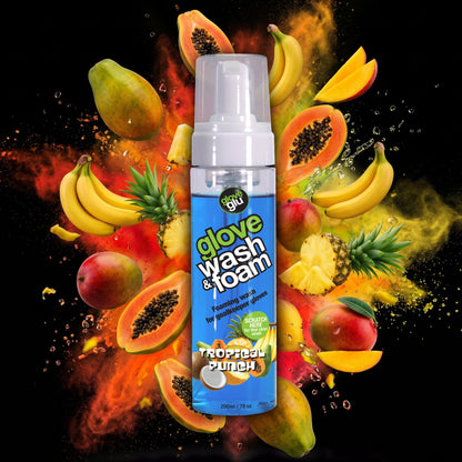 bottle of wash & foam with a spray of tropical fruit behind it